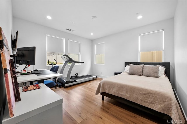 bedroom featuring recessed lighting, visible vents, and light wood-style flooring