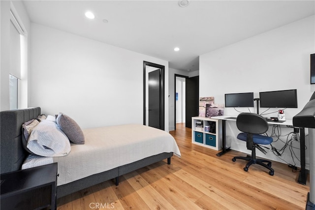 bedroom featuring recessed lighting and light wood-style flooring