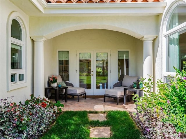 exterior space with french doors and stucco siding