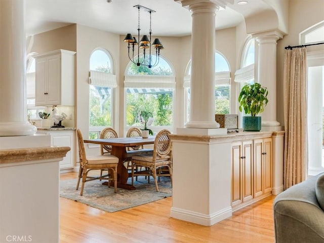 interior space with an inviting chandelier and a healthy amount of sunlight