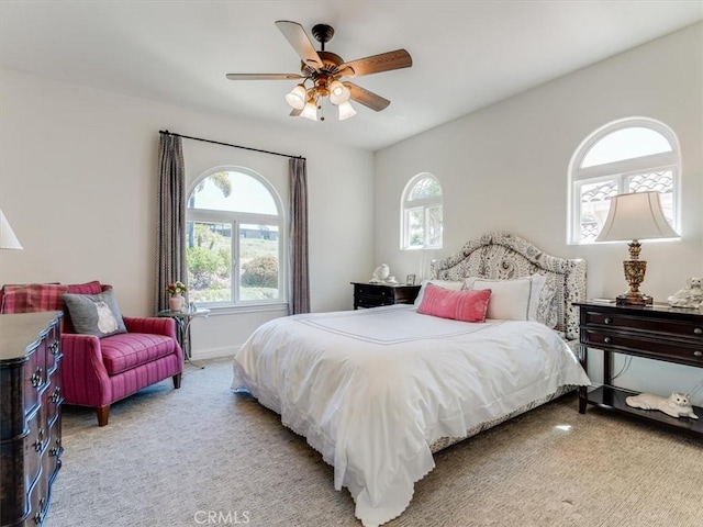 carpeted bedroom with a ceiling fan