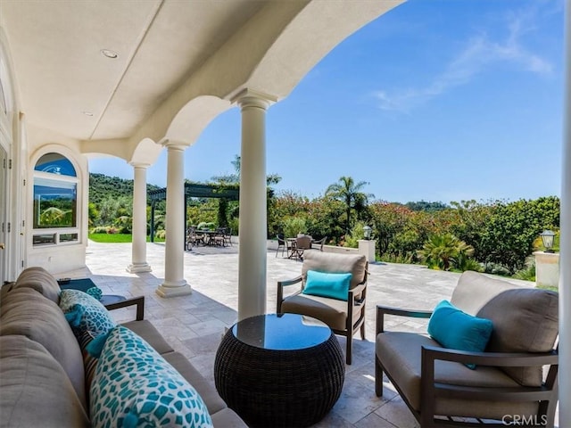 view of patio / terrace featuring outdoor dining space and an outdoor living space