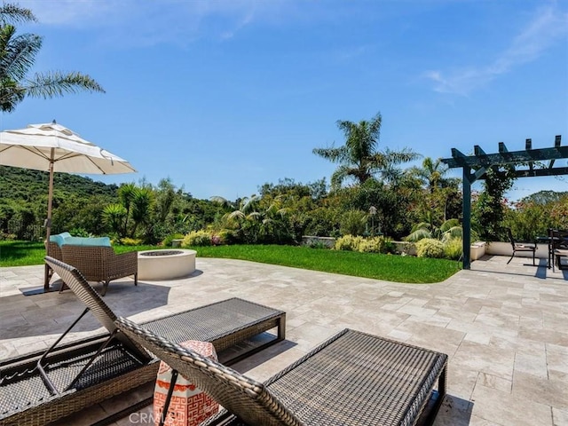 view of patio / terrace featuring a pergola and a fire pit