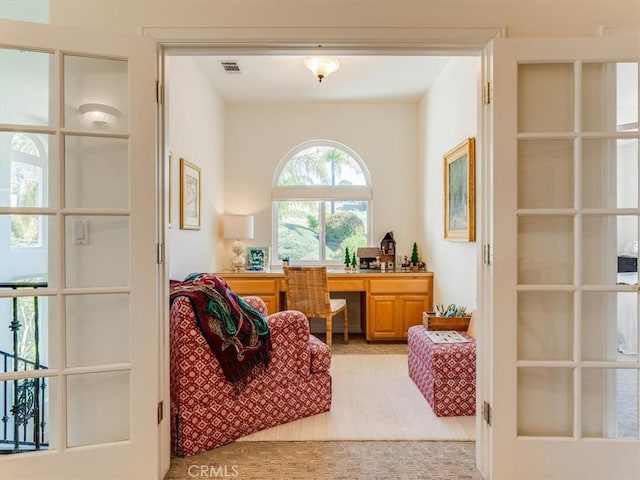 sitting room featuring visible vents