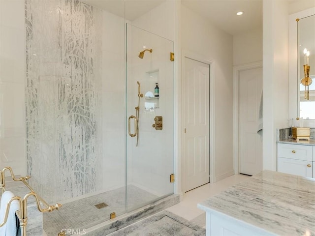 bathroom featuring recessed lighting and a stall shower