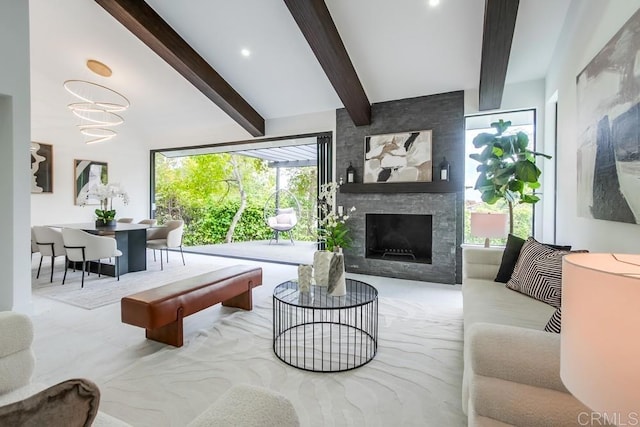 living area with a fireplace and beamed ceiling
