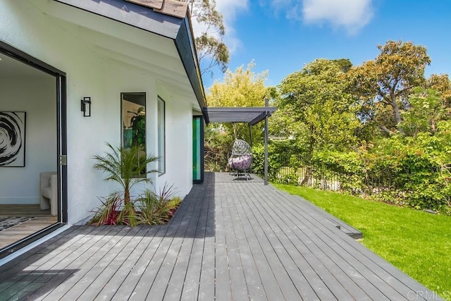 wooden terrace with a yard