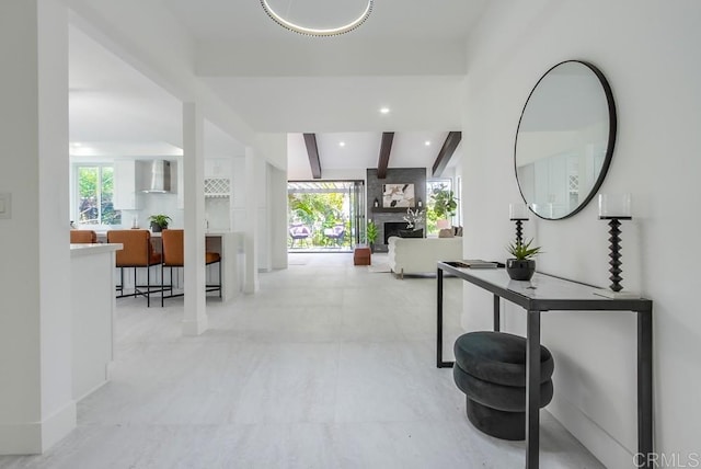 corridor featuring recessed lighting and beamed ceiling