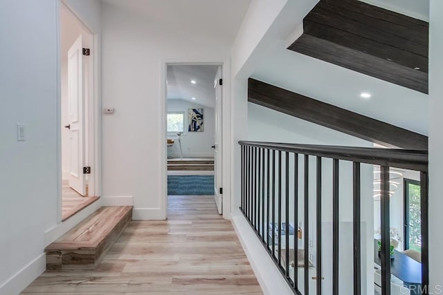 hall with baseboards, vaulted ceiling, recessed lighting, and wood finished floors
