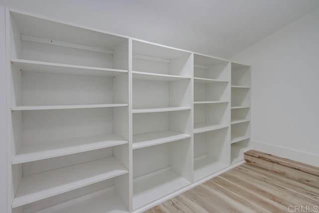 room details featuring baseboards and wood finished floors
