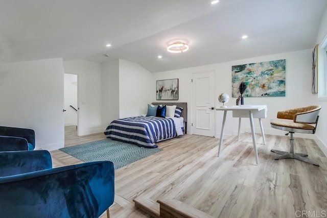 bedroom with recessed lighting, baseboards, light wood finished floors, and lofted ceiling