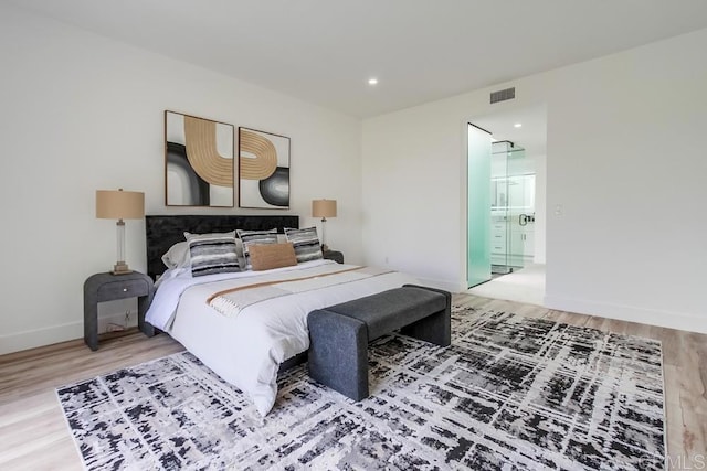 bedroom featuring recessed lighting, baseboards, visible vents, and wood finished floors