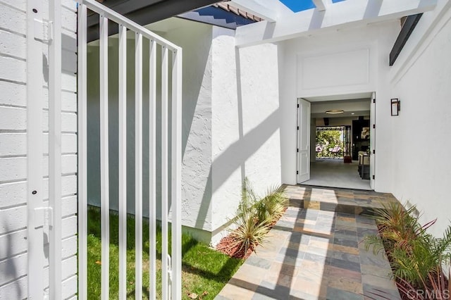 doorway to property with stucco siding