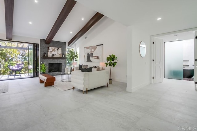 living room featuring vaulted ceiling with beams, recessed lighting, baseboards, and a fireplace