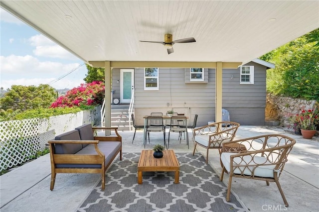 view of patio featuring entry steps, outdoor dining area, ceiling fan, and outdoor lounge area