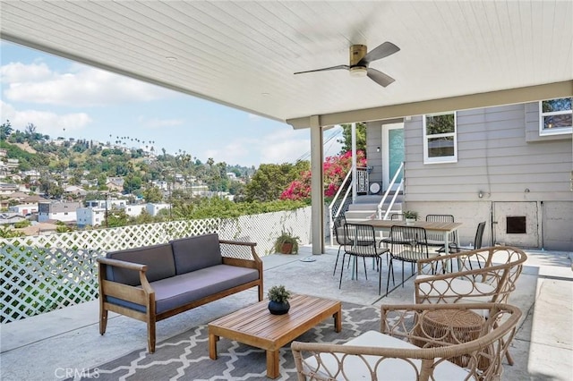 view of patio with a ceiling fan, outdoor dining space, and outdoor lounge area