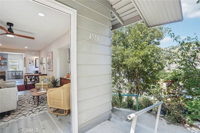 exterior space featuring a ceiling fan