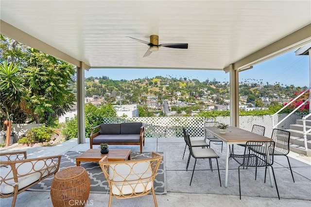 view of patio with ceiling fan, an outdoor living space, and outdoor dining area