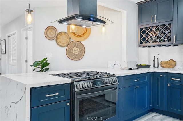 kitchen featuring blue cabinets, hanging light fixtures, range hood, light stone countertops, and stainless steel gas range oven
