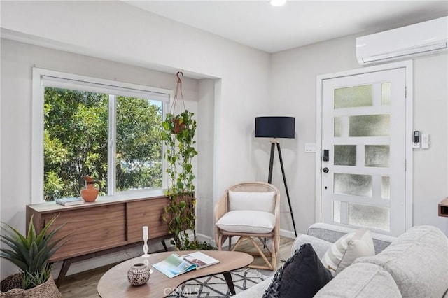 interior space featuring recessed lighting, baseboards, wood finished floors, and a wall mounted air conditioner