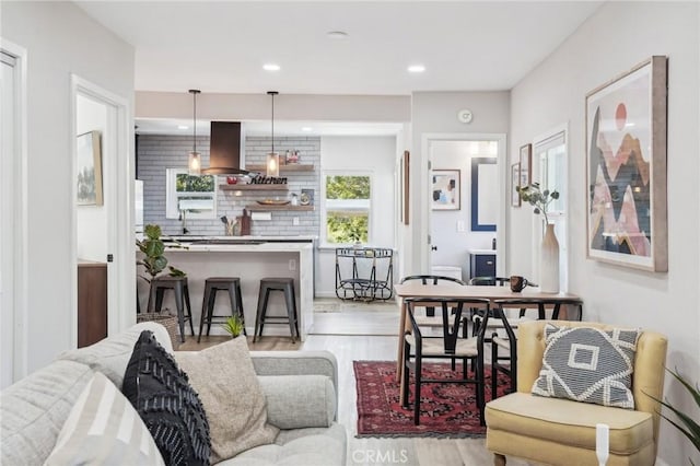 living room featuring recessed lighting and light wood-style flooring
