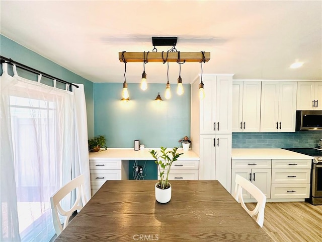 dining room with light wood-type flooring
