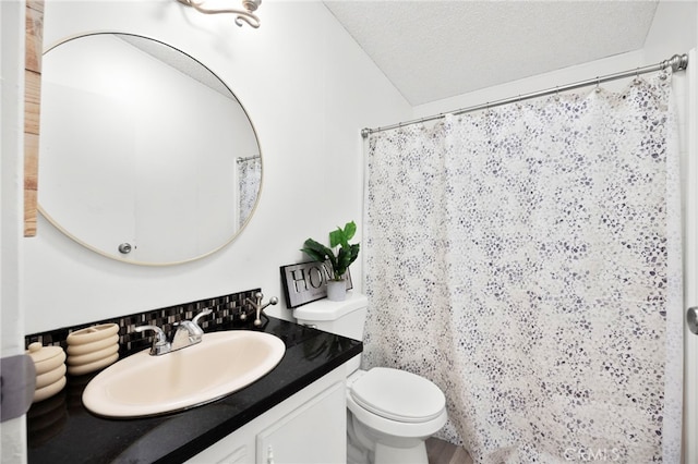 12859 Danbury St, Whitewater, CA 92282 - full bath featuring vanity, toilet, a shower with shower curtain, and a textured ceiling