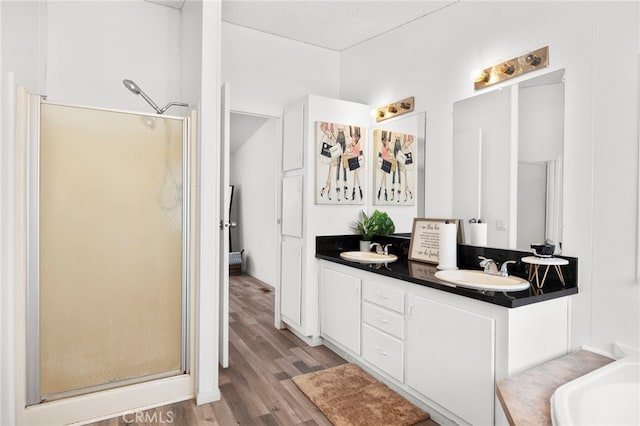 12859 Danbury St, Whitewater, CA 92282 - bathroom with a shower stall, wood finished floors, and double vanity
