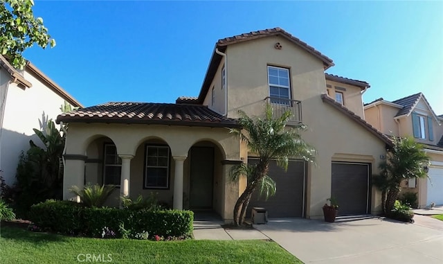 1730 W Alps Dr, Upland, CA 91784 - mediterranean / spanish-style house featuring a tiled roof, driveway, and stucco siding