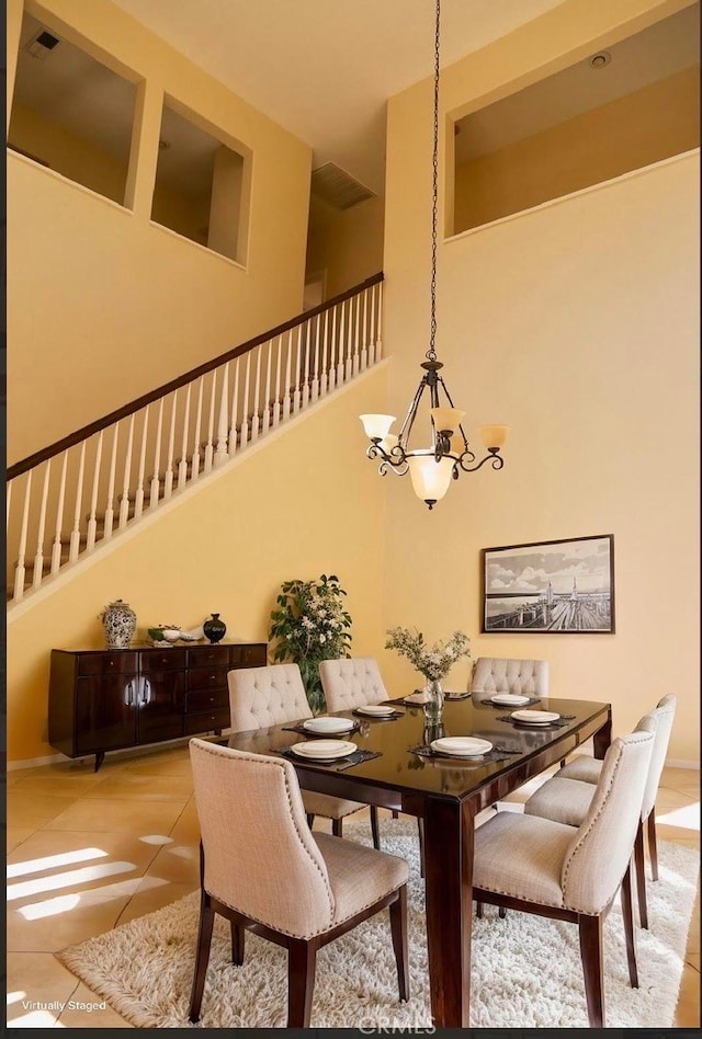 1730 W Alps Dr, Upland, CA 91784 - dining area featuring a chandelier, a high ceiling, and light tile patterned flooring