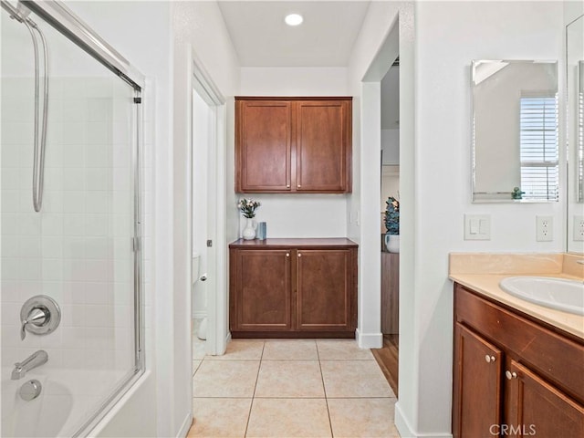 full bathroom featuring vanity, tile patterned flooring, baseboards, and bathing tub / shower combination