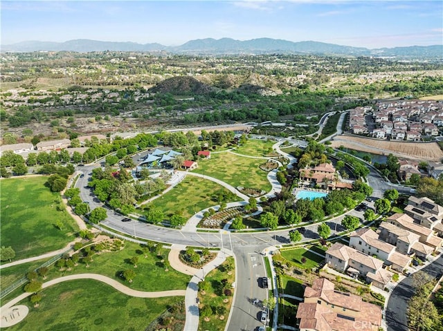 drone / aerial view featuring a residential view and a mountain view