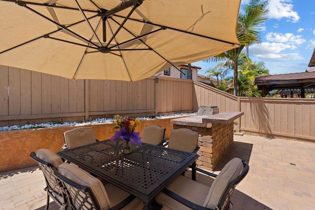 view of patio / terrace with outdoor dining area and fence