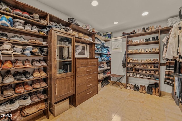 spacious closet with light tile patterned flooring