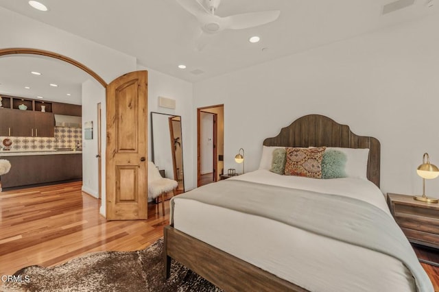 bedroom featuring a ceiling fan, recessed lighting, and wood finished floors