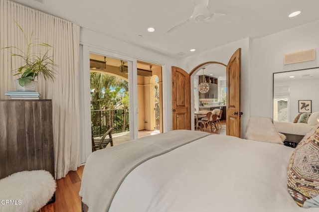 bedroom with recessed lighting, a ceiling fan, wood finished floors, and access to exterior