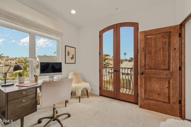 office space with french doors, recessed lighting, baseboards, and light carpet