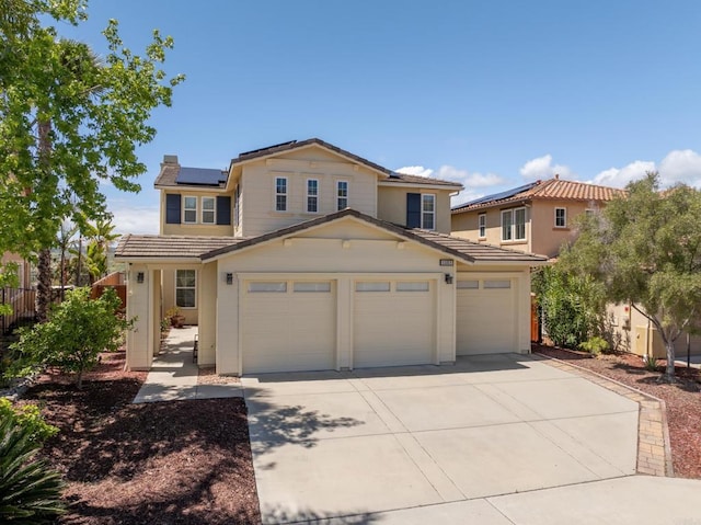 1185 Parkview Dr, Oceanside, CA 92057 - traditional home with fence, roof mounted solar panels, a tiled roof, concrete driveway, and an attached garage