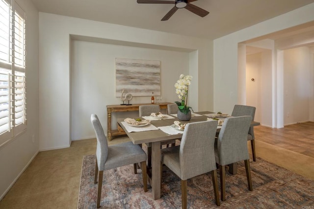 1185 Parkview Dr, Oceanside, CA 92057 - carpeted dining room with baseboards and a ceiling fan
