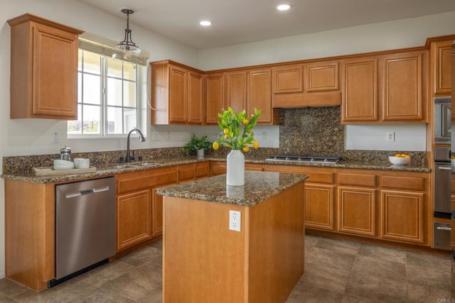 1185 Parkview Dr, Oceanside, CA 92057 - kitchen featuring brown cabinetry, a kitchen island, appliances with stainless steel finishes, a sink, and dark stone counters