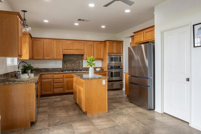 1185 Parkview Dr, Oceanside, CA 92057 - kitchen featuring a ceiling fan, a kitchen island, visible vents, appliances with stainless steel finishes, and a warming drawer