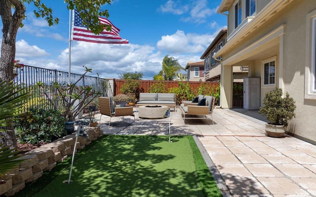 1185 Parkview Dr, Oceanside, CA 92057 - view of patio featuring a fenced backyard and an outdoor living space with a fire pit