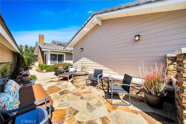 view of patio / terrace featuring a fire pit