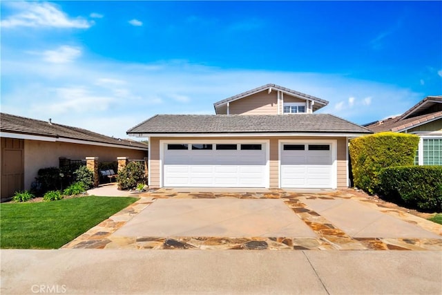 garage with concrete driveway