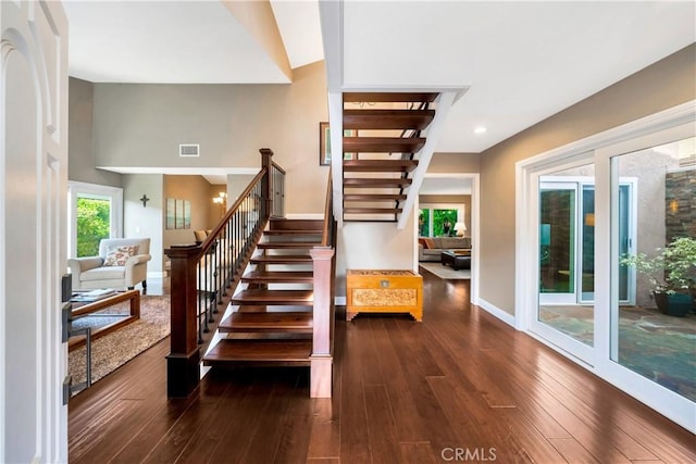 staircase featuring recessed lighting, baseboards, hardwood / wood-style flooring, and visible vents