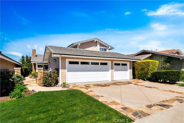 view of front of house with an attached garage, a front lawn, a chimney, and concrete driveway