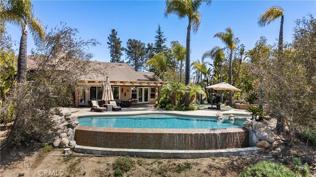 3988 Keri Way, Fallbrook, CA 92028 - swimming pool with french doors and a patio area