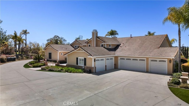 3988 Keri Way, Fallbrook, CA 92028 - view of front of house featuring a tile roof, an attached garage, driveway, and a chimney