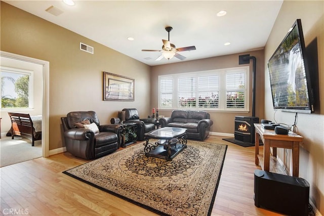 3988 Keri Way, Fallbrook, CA 92028 - living area featuring a wood stove, ceiling fan, light wood-style flooring, recessed lighting, and baseboards
