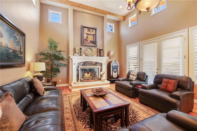 3988 Keri Way, Fallbrook, CA 92028 - living area featuring a towering ceiling, wood finished floors, a fireplace, and baseboards
